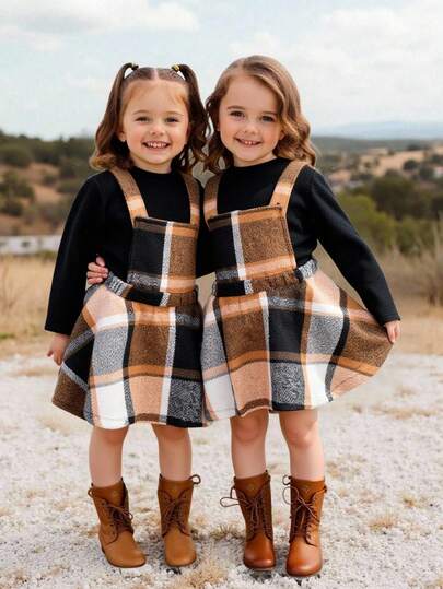 女婴秋冬两件套：立领宽松套头衫+复古格子背带裙套装，舒适百搭，适合居家、外出、上学等场合，加厚保暖面料，秋冬季节穿着舒适。