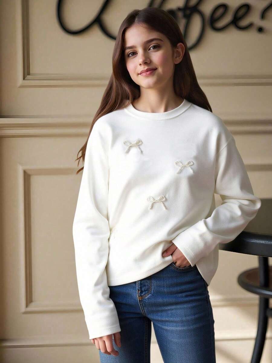 Sparklyn Tween-Mädchen Einfarbiges, lässiges T-Shirt mit Rundhalsausschnitt, langen Ärmeln und Schleifendekor aus Kunstperlen