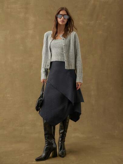 Nöista Women's Navy Pinstripe Midi Skirt Featuring A Draped Asymmetrical Overlay. Perfect For Office Wear, Formal Events, And Stylish Parties, This Elegant Skirt Adds A Sophisticated Touch To Autumn Outfits And Fall Clothes For Women, Blending Classic Design With Modern Flair.