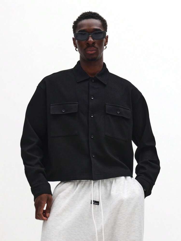 Veste courte boutonnée avec poches poitrine