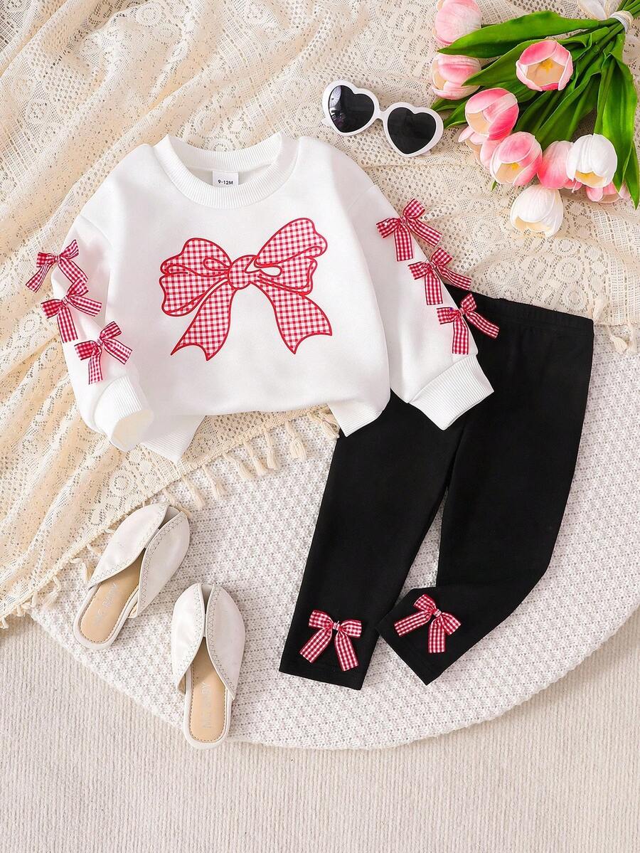 SHEIN Playful Pals 2 件套女婴服装：白色运动衫，带可爱蝴蝶结和格子印花，长袖圆领运动衫和黑色松紧腰打底裤，适合休闲、户外、旅行，6 个月 - 3 岁 - 黑與白 - 查看 1