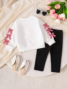 SHEIN Playful Pals 2 件套女婴服装：白色运动衫，带可爱蝴蝶结和格子印花，长袖圆领运动衫和黑色松紧腰打底裤，适合休闲、户外、旅行，6 个月 - 3 岁 - 黑與白 - 查看 2