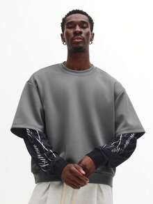 SUMWON Sudadera oversize de hombros caídos con inserto de manga de malla, gráficos de texto en letra audaz, diseño de manga larga con capas, estilo callejero contemporáneo esencial - Gris - Ver 1