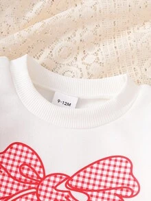 SHEIN Playful Pals 2 件套女婴服装：白色运动衫，带可爱蝴蝶结和格子印花，长袖圆领运动衫和黑色松紧腰打底裤，适合休闲、户外、旅行，6 个月 - 3 岁 - 黑與白 - 查看 5