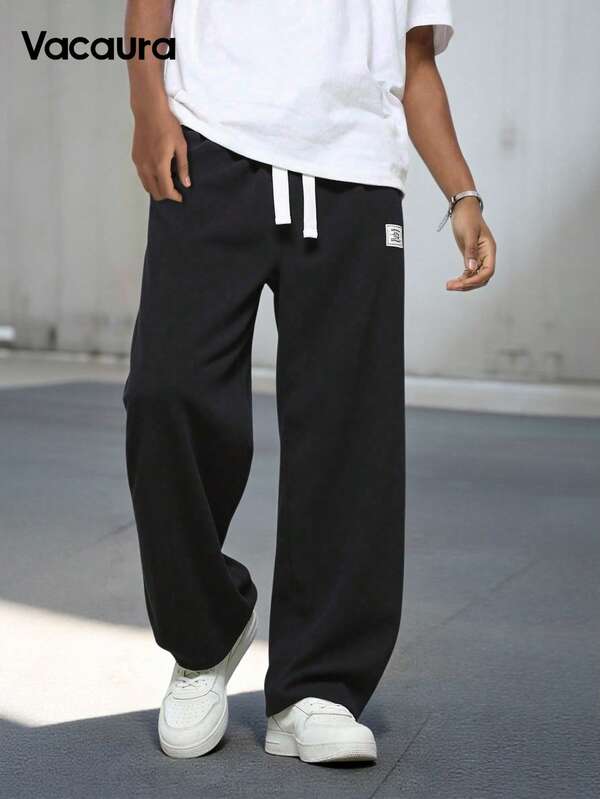 SHEIN Spodnie dresowe dla chłopców w jednolitym kolorze, ściągane sznurkiem w pasie