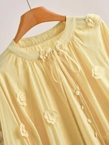 CosyJoli Blusa elegante da donna taglie forti, a maniche a lanterna, con decorazione floreale e laccio frontale, di colore unito