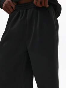 SUMWON Conjunto de dos piezas de ropa de calle informal de forro polar abrigador con sudadera con media cremallera y pantalón ancho de pierna - Negro - Ver 7