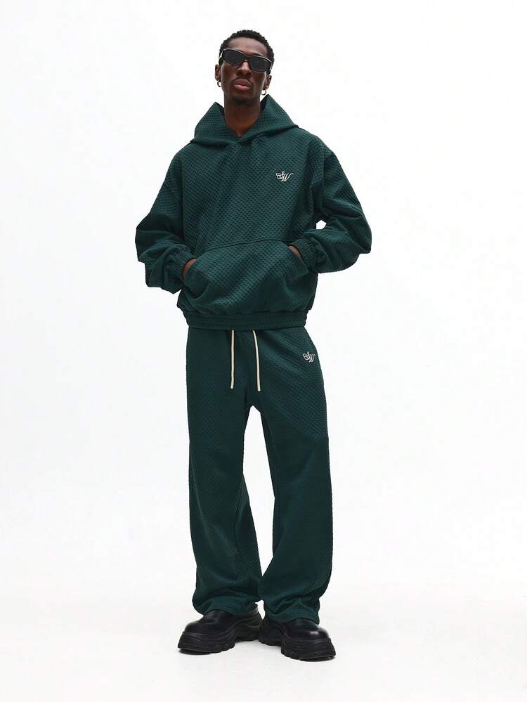 Komplet z teksturowaną pikowaną bluzą z kapturem i spodniami dresowymi ze ściągaczem