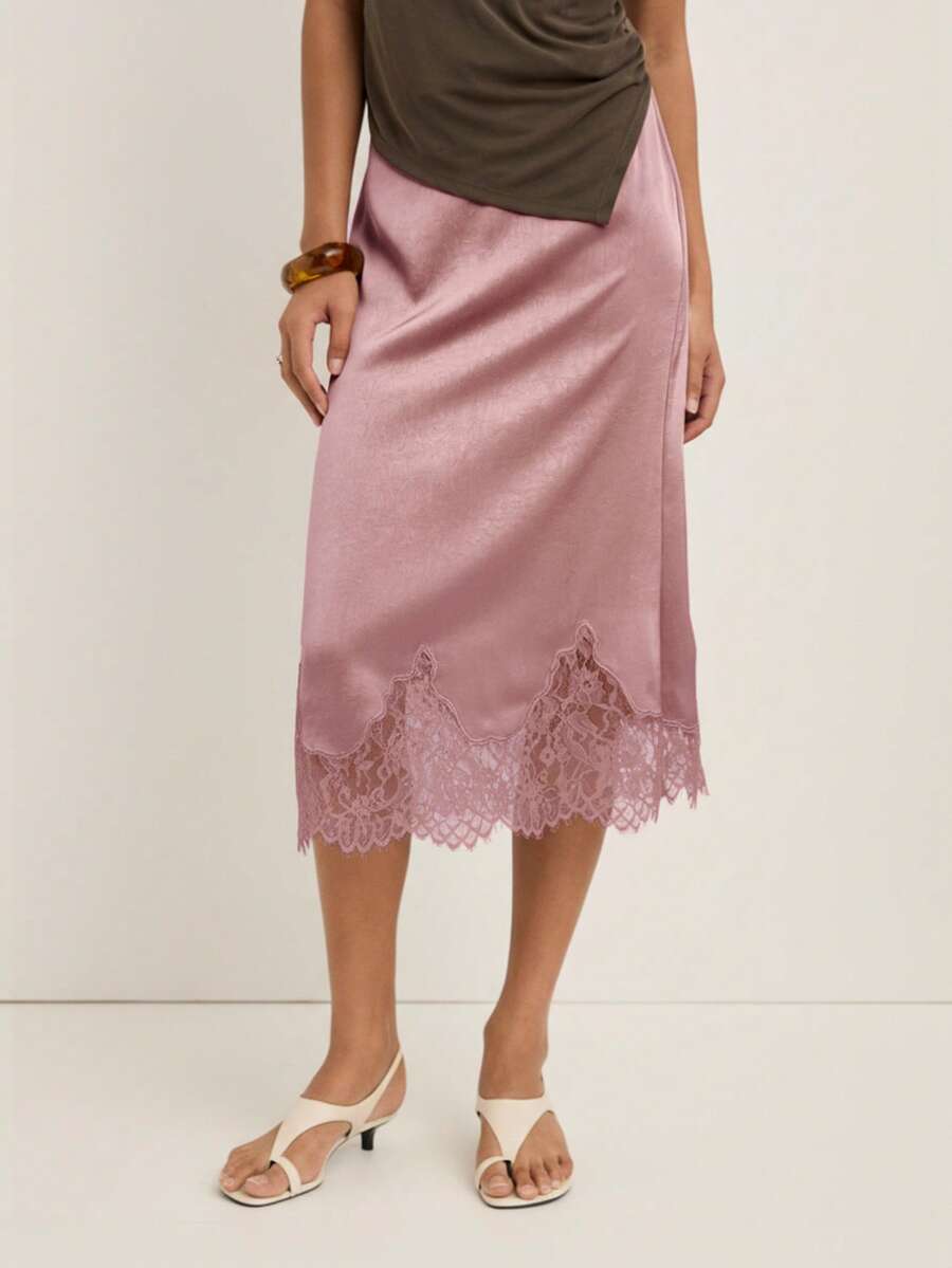 Nöista 这款优雅的女士半身裙饰有精致的蕾丝裙边，非常适合正式场合、派对装扮和精致的冬季造型；它是一款百搭单品，可轻松搭配衬衫或针织衫，为女性的冬季衣橱增添永恒的优雅气质，无论是休闲造型、优雅着装、圣诞节装扮还是精致的新年庆祝活动，都能完美驾驭。 - 藕粉色 - 查看 1