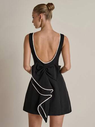 COSMINA Vestido corto elegante y de moda para mujer con cuentas y sin espalda ni mangas