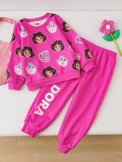 DORA | SHEIN 2 pièces/Set Sweat-shirt à col ras-du-cou à manches longues avec imprimé Dora la Exploratrice pour jeune fille et pantalon de survêtement long avec graphique lettrage, tenue décontractée rose pour les sports de plein air