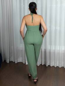 Melissa Matos Damsommarjumpsuit med halterneck och rygglös ficka - Grön - Visa 2