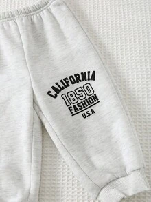 Cozy Pixies Set de 2 piezas de sudadera con capucha de manga larga y pantalón jogger de cintura elástica con estampado de letras minimalista para bebé niño