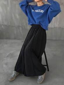 FRIFUL Falda maxi acampanada de punto holgada y versátil con cintura elástica de tela texturizada negra sólida, para otoño/invierno