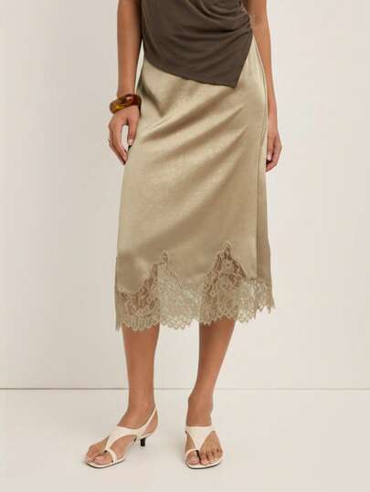 Nöista Elegant Skirt For Women Featuring A Delicate Lace Hem, Perfect For Formal Occasions, Party Outfits And Refined Winter Looks; A Versatile Piece That Pairs Effortlessly With Blouses Or Knitwear, Adding Timeless Sophistication To Women's Winter Wardrobes For Casual Styling, Elegant Dressing, Christmas Outfits And Polished New Year Celebrations.