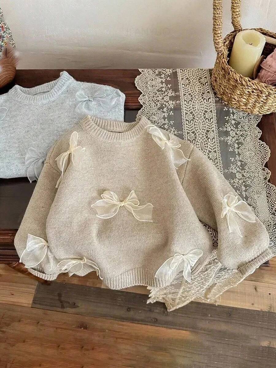 SHEIN Frenchy 女士休闲优雅百搭毛衣,带 3D 蝴蝶结丝带装饰,秋冬女装 - 杏色 - 查看 1