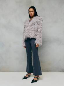 TypaGal Cozy And Glamorous, This Gray Jacket Features Plush Faux Fur With A Voluminous Texture For Warmth And Style. Perfect For Layering Over Evening Or Casual Outfits, This Gray Coat Adds Instant Luxury To Your Winter Wardrobe.
