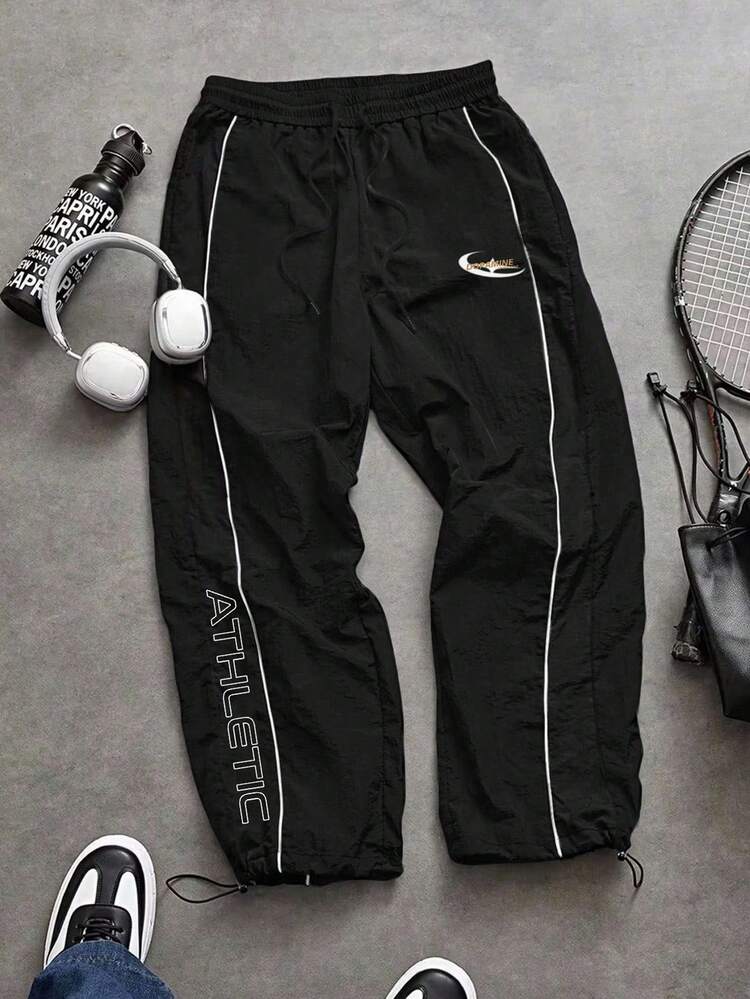 Manfinity Sport Corelite Pantalones de chándal casuales para hombres con cintura con cordón, ajuste holgado, estampado de letras, transpirables, que absorben la humedad, ligeros, cómodos, de pierna ancha, diseño minimalista, ajuste delgado para entrenamiento y ropa de gimnasio - Negro - Añade 3
