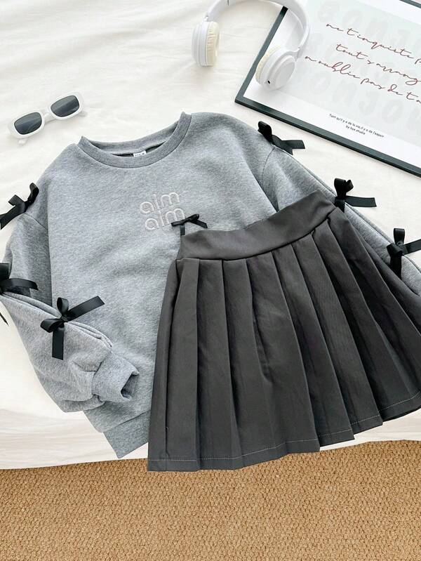 Genkimix Kids Girls' Minimalist Fashion Korean Style 3D Bow Decor Round Neck Grey Sweatshirt Paired With Matching Pleated Skirt Set, Youthful School Style For Casual Or Sports Wear, Autumn Fall Winter