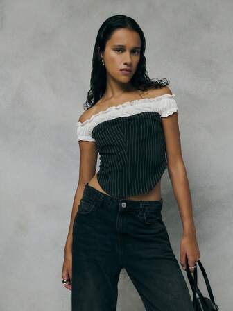 TypaGal Channeling A Romantic-Meets-Tailored Vibe, This Black Corset Top Contrasts Sharp Pinstripes With Soft Off-Shoulder White Ruffles. The Curved Hem Adds Structure, Making It A Standout Among Elegant Women's Blouses And Black Tops. Ideal For Pairing With Black Jeans Or As A Twist On Casual Blouses For Ladies.