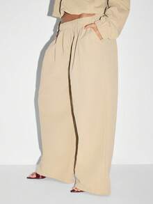 KIZN Pantalon ample plissé de type palazzo, tenue d'été pour la plage et les vacances. Élégant et minimaliste, pantalon ample et fluide en nylon, parfait pour se détendre pendant les vacances.