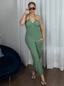 Melissa Matos Damsommarjumpsuit med halterneck och rygglös ficka - Grön - Visa 1
