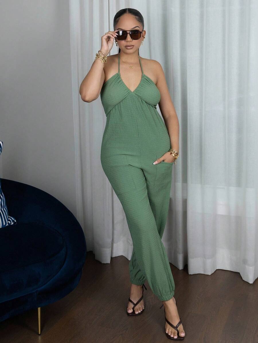 Melissa Matos Damsommarjumpsuit med halterneck och rygglös ficka - Grön - Visa 1