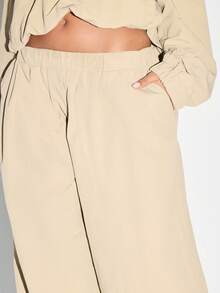 KIZN Pantalon ample plissé de type palazzo, tenue d'été pour la plage et les vacances. Élégant et minimaliste, pantalon ample et fluide en nylon, parfait pour se détendre pendant les vacances.