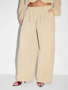 KIZN Pantalon ample plissé de type palazzo, tenue d'été pour la plage et les vacances. Élégant et minimaliste, pantalon ample et fluide en nylon, parfait pour se détendre pendant les vacances.
