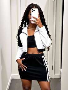 Zolique Bộ áo khoác hai mảnh màu đen trắng có khóa kéo phía trước và chân váy sọc hai bên cho nữ - màu đen - Xem 3