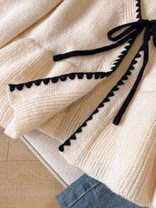 SHEIN Frenchy 女士法式休闲秋冬针织开衫，撞色刺绣滚边，前系带，荷叶边下摆和袖口，长袖，适合日常通勤。