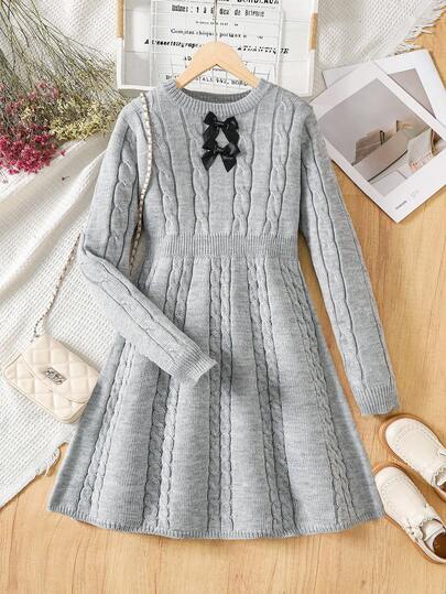 1 pieza Vestido de suéter de punto para adolescentes, textura de punto de cable minimalista de cuello redondo, decoración de lazo 3D negro, cintura ceñida, vestido de suéter de manga larga de grosor regular, unicolor versátil y elegante, textura suave y lisa, adecuado para uso casual, al aire libre, reuniones, compras en otoño/invierno