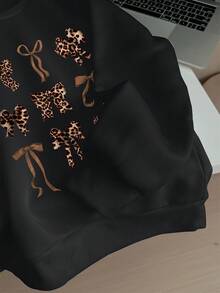 Attitoon Sudadera holgada de cuello redondo con estampado de lazo de leopardo en estilo retro americano minimalista casual, adecuada para otoño/invierno