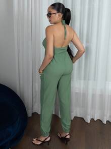 Melissa Matos Damsommarjumpsuit med halterneck och rygglös ficka - Grön - Visa 6