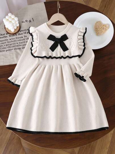 年轻女孩圆领长袖荷叶边撞色蝴蝶结装饰时尚针织毛衣裙