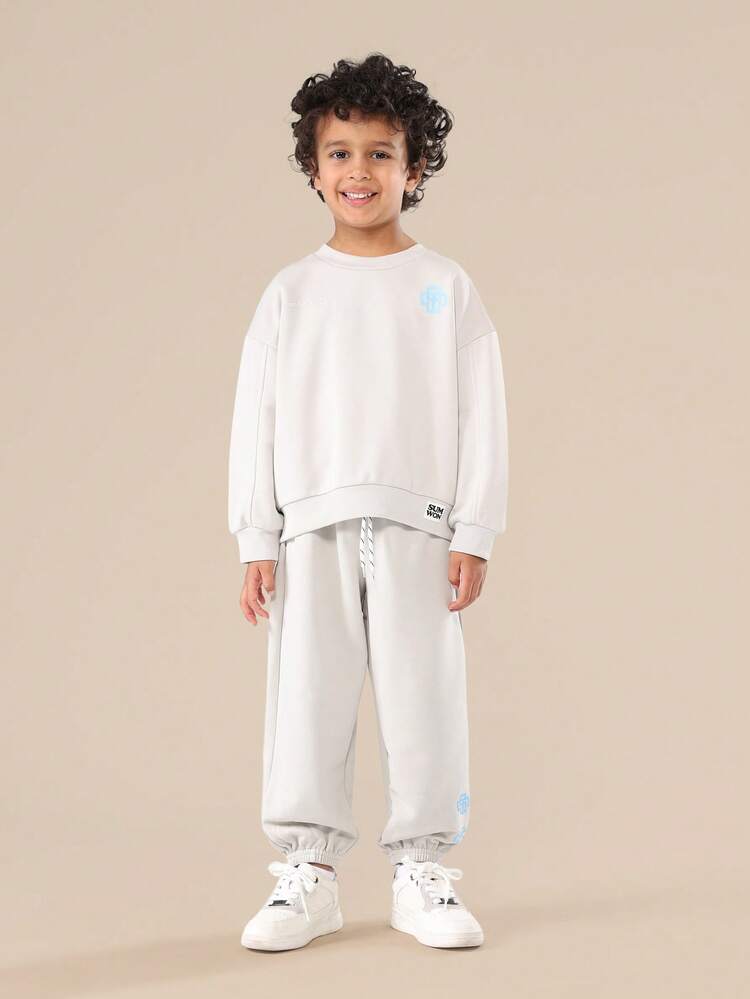 Komplet spodni dresowych ze ściągaczem i bluzy z okrągłym dekoltem