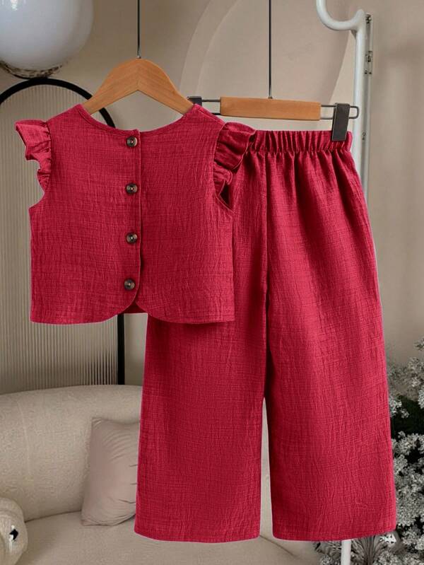 Conjunto de 2 piezas de camiseta de manga corta con botones en la espalda y pantalones casuales largos de tela texturizada para niñas pequeñas