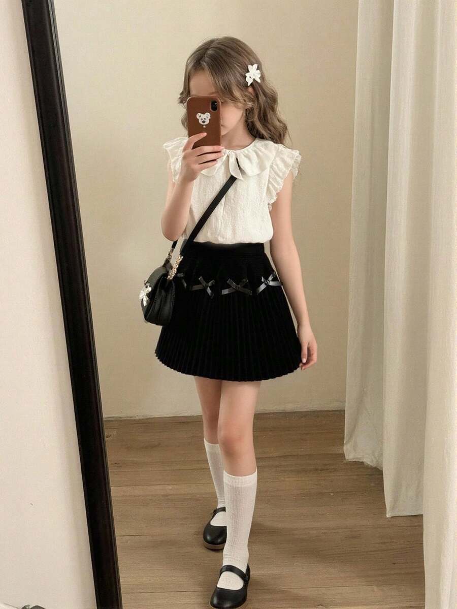 تنورة مبرمجة مزينة بفيونكة سوداء للبنات الصغيرات، بتصميم بسيط وجميل، من الأقمشة الناعمة والمريحة، مناسبة للاستخدام اليومي والخارجي والسفر والعطلات والمنزل وحضانة الأطفال في فصلي الخريف والشتاء، وأيضًا لحفلات عيد الميلاد والعودة للمدرسة والحفلات، وتناسب جميع الملابس