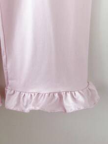 Bộ 2 món đồ ngủ bé gái màu hồng nhạt dễ thương, đơn giản, có bèo nhún ở tay áo và gấu quần, in hình kỳ lân ở ngực trái, có túi phía trước, tay dài và quần dài, kiểu dáng thoải mái, màu hồng nhạt, có bèo nhún. - Hồng - Xem 5