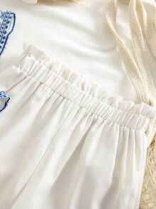 SHEIN Conjunto de 2 piezas de chaqueta de punto con estampado floral y pantalones casuales holgados para niña - Blanco - Ver 8