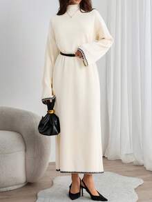 EURMUSE Elegant Cream Ribbed Knit Maxi Dress With Mock Neck And Subtle Black Contrast Wave Hem – Minimal Winter Statement Piece Elegant Cream Rib Knit Maxi Sweater Dress With Contrast Trim And Belted Waist For Minimal Chic Fall Looks - Beige - View 3