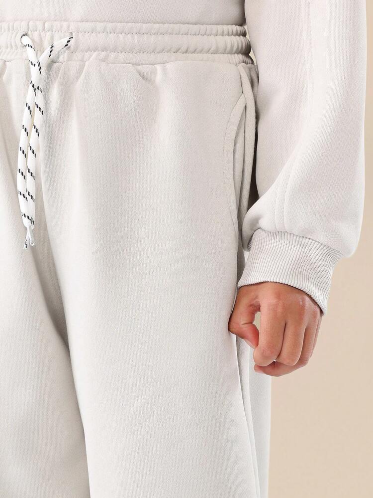 Komplet spodni dresowych ze ściągaczem i bluzy z okrągłym dekoltem