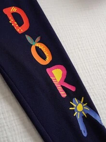 DORA | SHEIN 2 pièces/Set Jeune fille Mignon Dora Dessin animé Graphique Col rond Manches longues Sweat-shirt et Leggings ajustés Élastiques Imprimé Lettre Tricot Sport Décontracté Tenue Extérieure