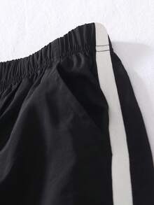 Genkimix Kids New Arrival Energetic Tween BoysLoose V-Neck Long Sleeve Letter Print T-Shirt With Relaxed Cuffed Pants Set. The T-Shirt Features A Distinctive Ribbed Black And White Collar Design With A Meaningful Letter Print, Paired With Comfortable, Soft And Loose Cuffed Pants. Fashionable, Versatile And Practical, Very Suitable For Boys To Wear In Daily Scenarios Like Going To School, Playing In The Community, Or Going Shopping.