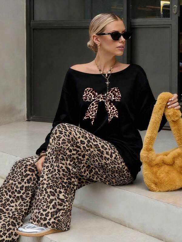 Aloruh Sudadera holgada de manga larga delgada con estampado de leopardo y lazo, en color negro, para mujer en otoño/invierno