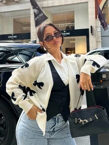 NegzBox Blusa de manga larga con botones delanteros y detalle de lazo, diseño minimalista para mujer