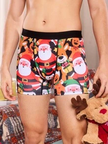 Weihnachtliche Boxershorts mit witzigem, cartoonhaftem Muster von Weihnachtsmann, Geschenkbox, Zuckerstange, Glocke, Schneeflocke, Schneemann, für Familienpartys