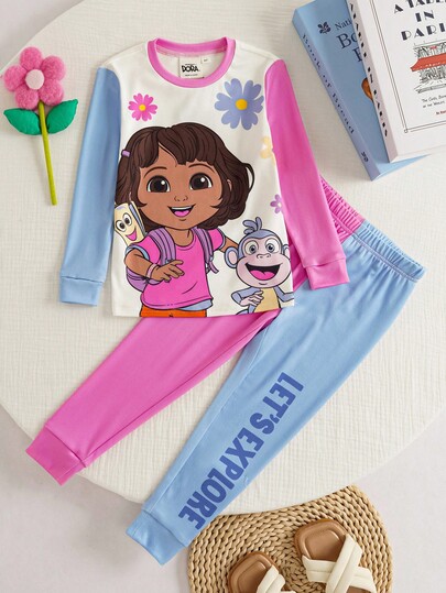 DORA | SHEIN Set de 2 piezas de pijama cómodo y elástico con top de manga larga con cuello redondo y gráfico de dibujos animados de bloques de color, y pantalones para niña joven