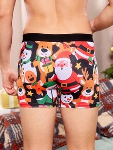 Weihnachtliche Boxershorts mit witzigem, cartoonhaftem Muster von Weihnachtsmann, Geschenkbox, Zuckerstange, Glocke, Schneeflocke, Schneemann, für Familienpartys