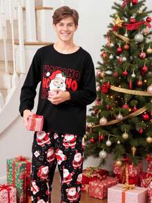 Set de pijama de 2 piezas con estampado de Papá Noel para niños adolescentes, que incluye top de manga larga de cuello redondo negro y pantalones holgados con estampado total